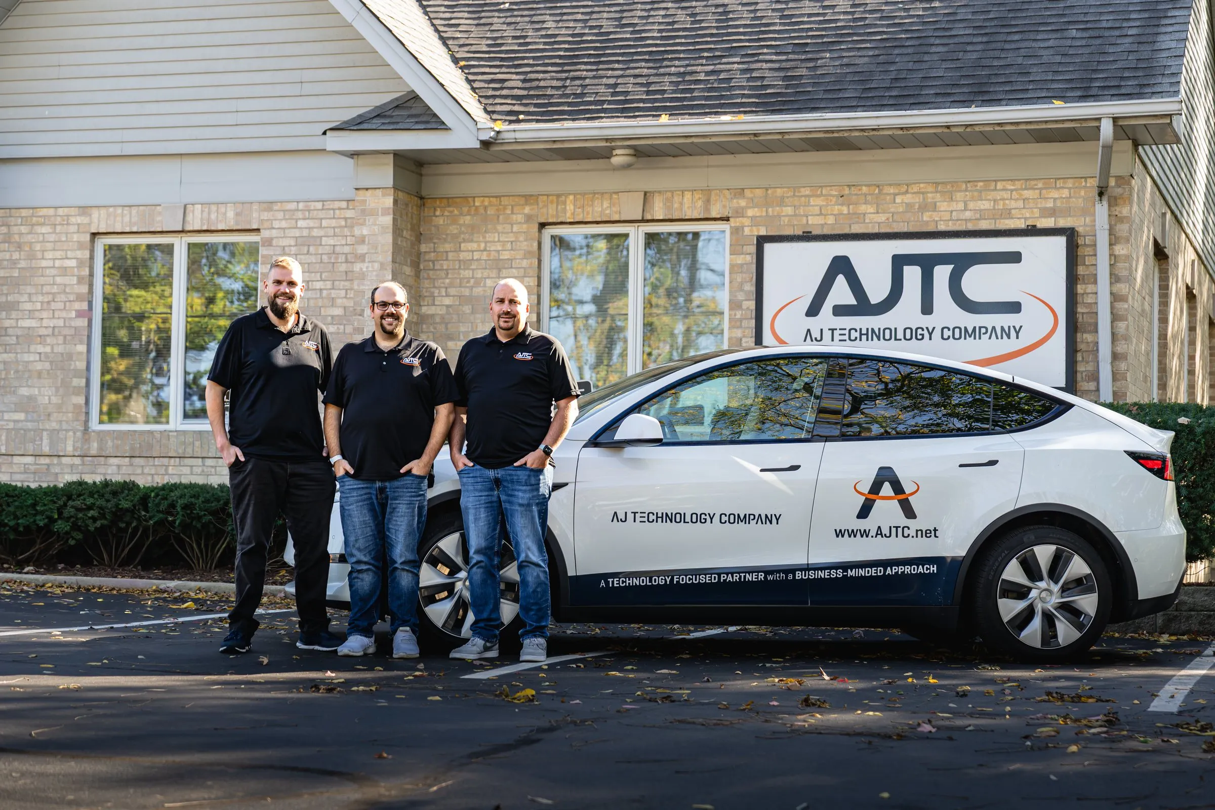 AJTC leadership team outside the Homer Glen headquarters