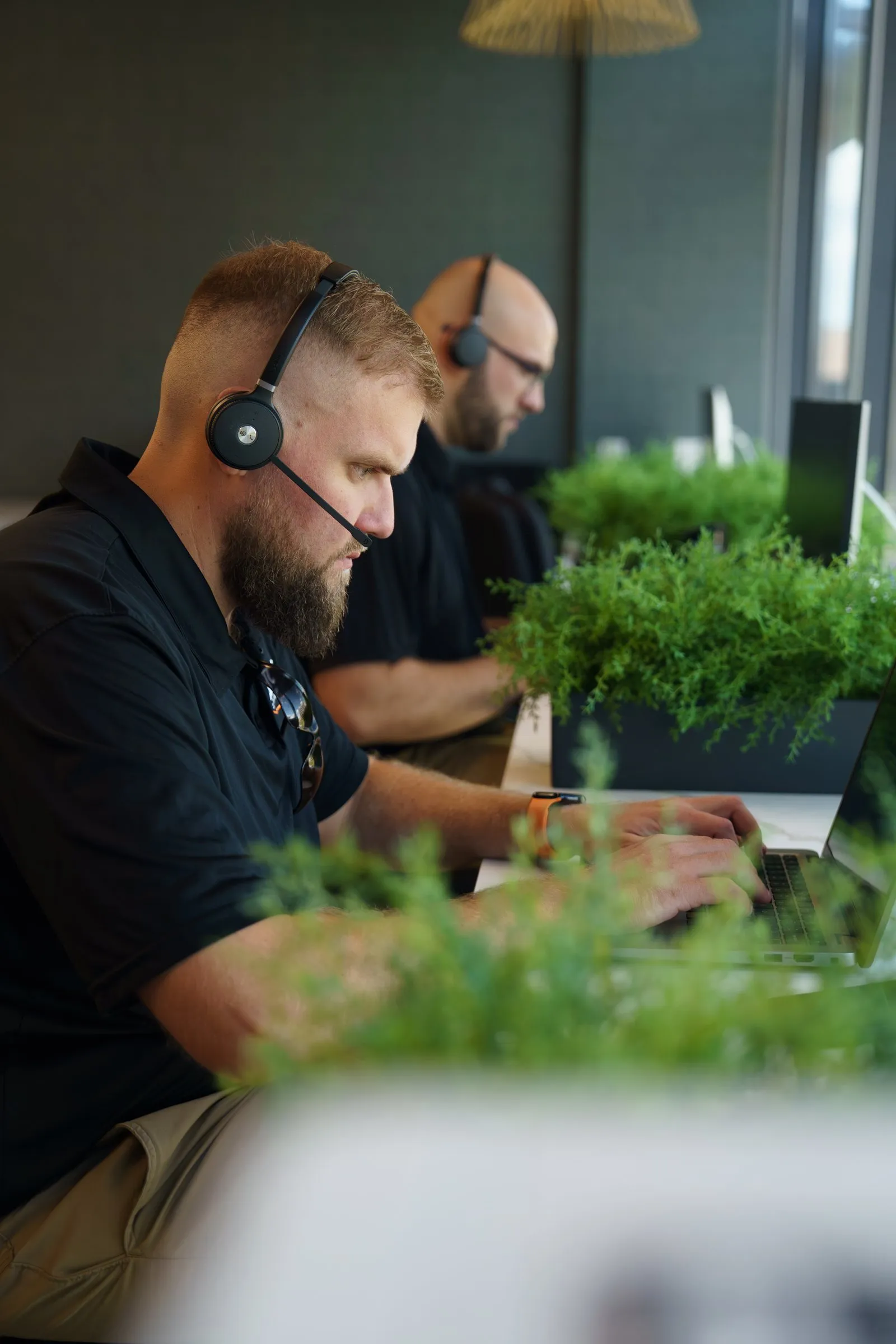 AJTC technicians taking support calls in the Phoenix office