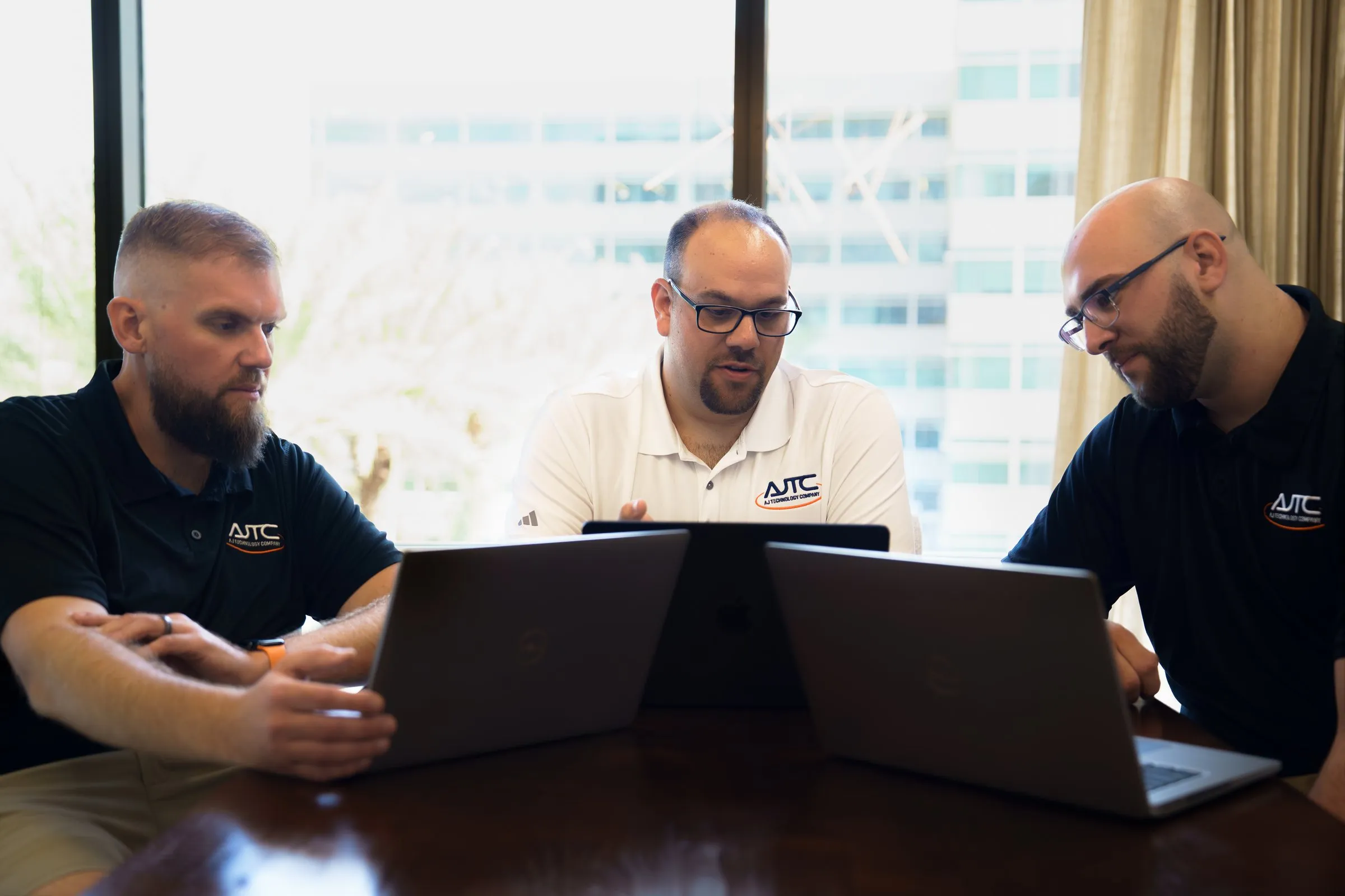 AJTC Phoenix engineers reviewing a client project